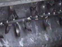 the mycelium at the surface is broken up by the rotating tines of a ruffler